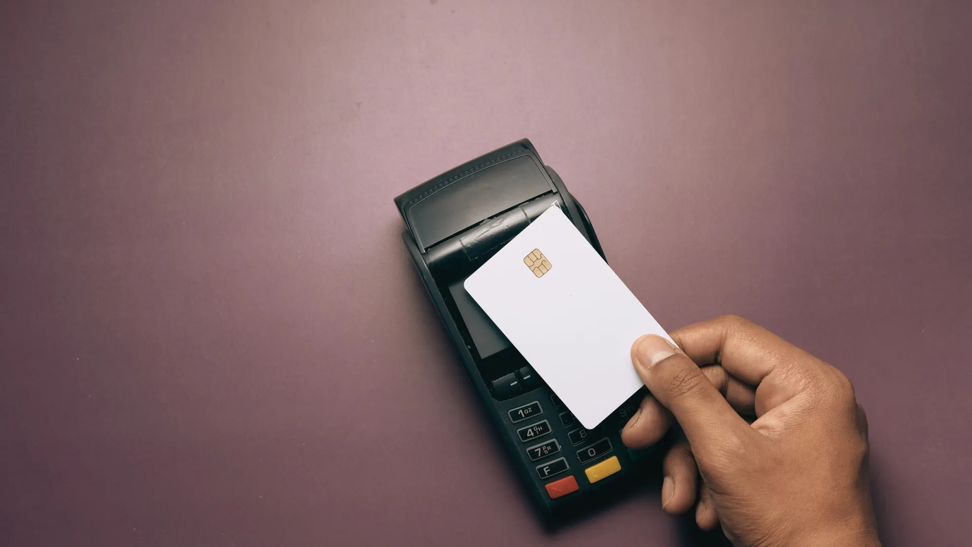 A customer presenting a chip card at a payment terminal